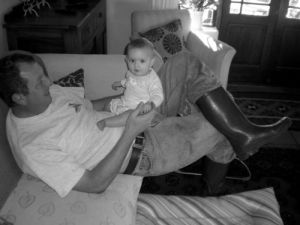 Louis with boots, playing with Bea